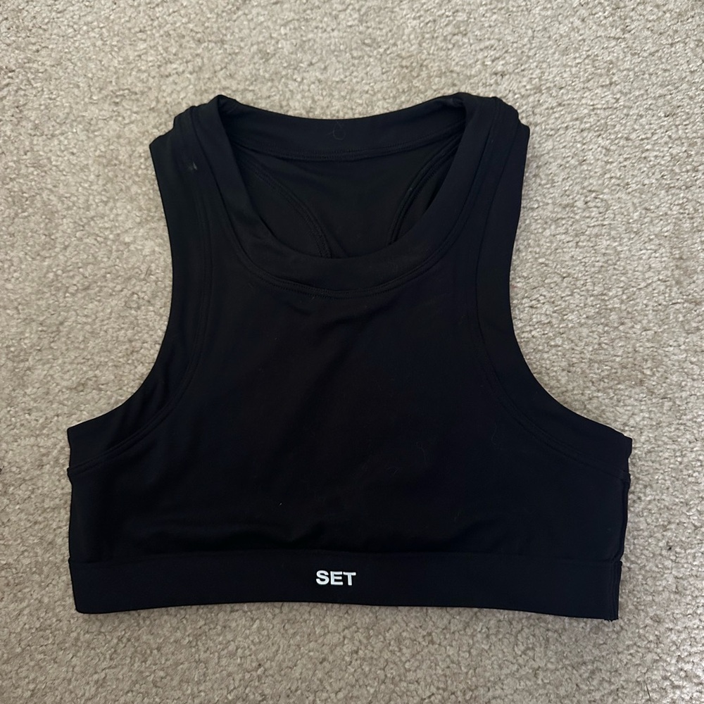 Set Active black high neck sportbody bra. Never worn. Size medium.